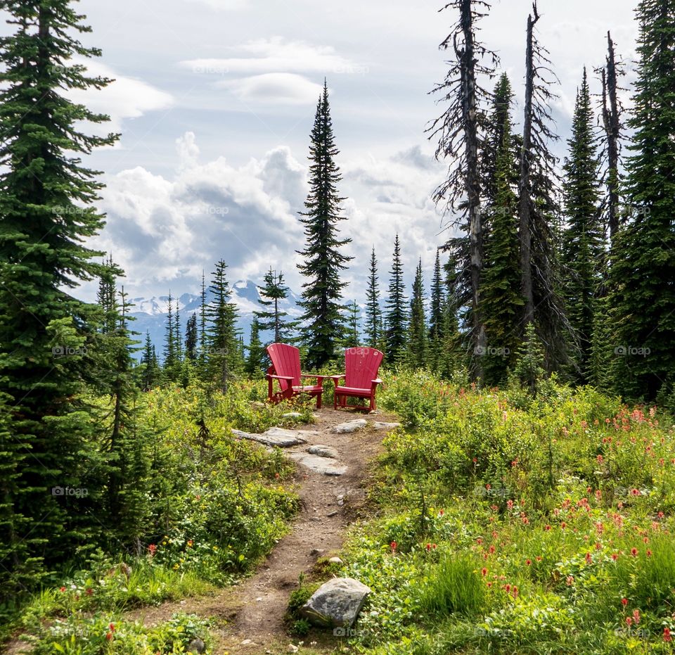 Red chairs on top of a scenic mountain - wow!