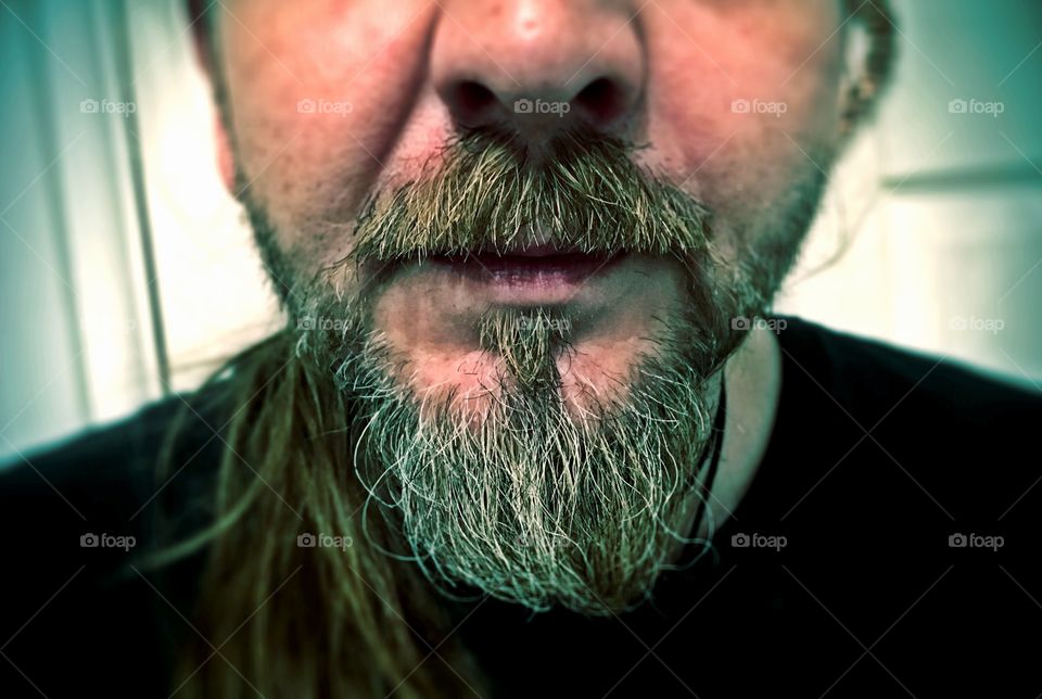 Growing out a goaty into a bushy beard. 