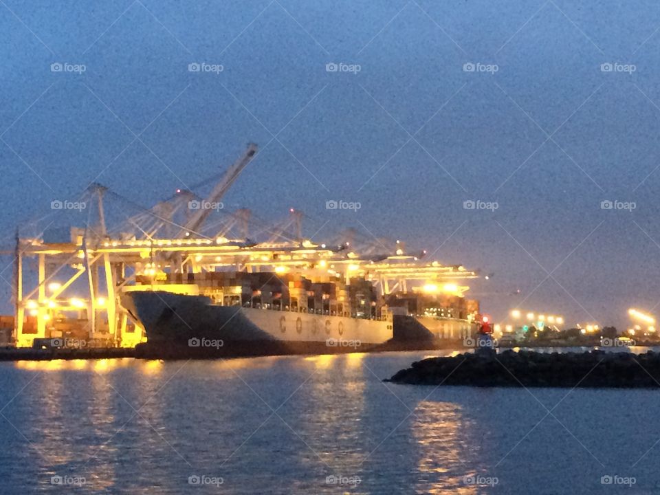 Port of Long Beach cargo ship and cranes 