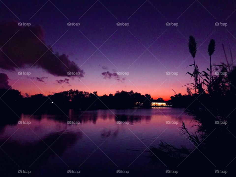 Call it a Beautiful Sunset. Reflections sky to Lake Purple Hues, silhouette on lake waters. You just never know what the good lord will provide when asked for.