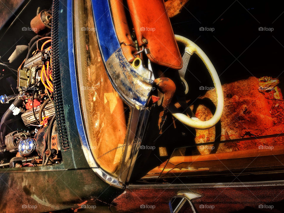 Old corvette rusting in a California desert wasteland