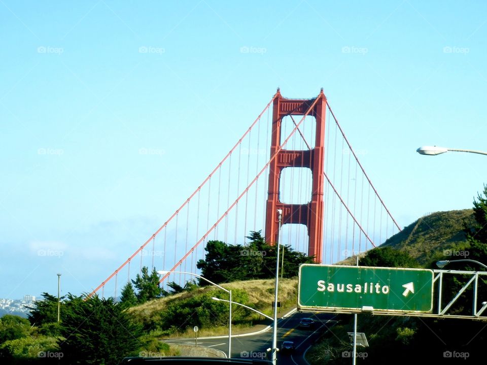 A view of the Golden Gate Bridge and the Sausalito sign. 