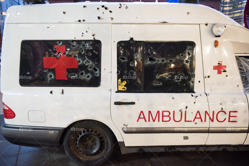 A real ambulance from the Red Cross who had been attacked in war. The Ambulance has bulletholes just everywhere and even firebombs have been thrown against it. The ambulance is part of efforts to make people aware of what happens in war. Ambulance shown up in various parts of the world. The picture is from Malmö Sweden.