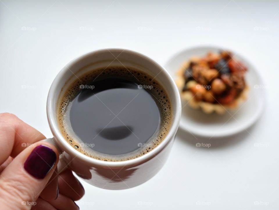 coffee cup with cake on a white background