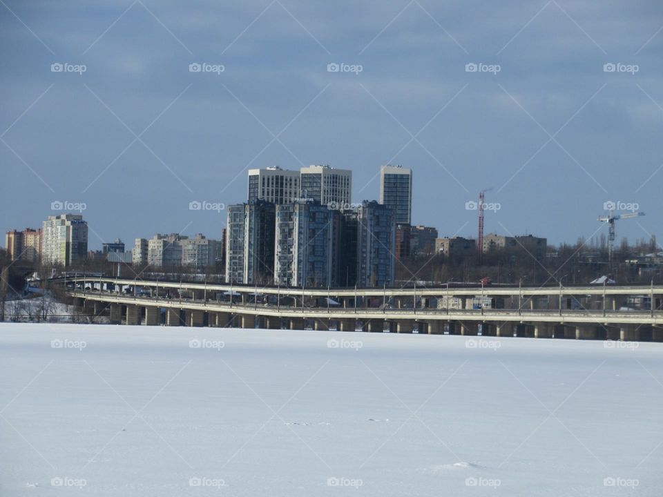 river under snow, winter, frost, ice, the sun shines but does not warm, February winter month