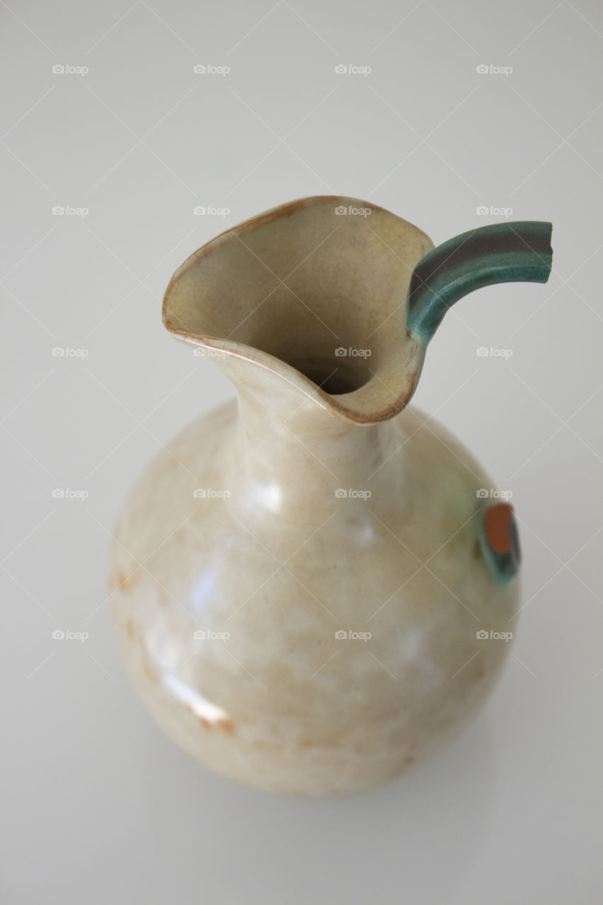 Old carafe white broken handle 