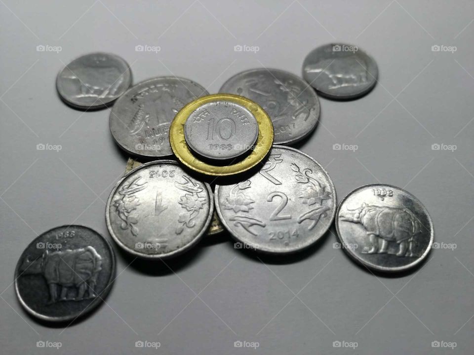 A lot of coins on white paper background.concept of hobby and money.