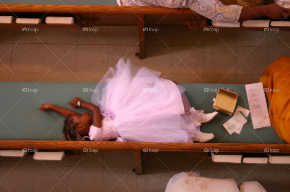Sleepy Flower Girl. I was up in the church balcony photographing the wedding, looked down and got this shot