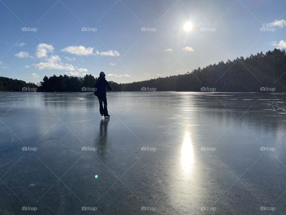 Ice skating on a lake in Sweden