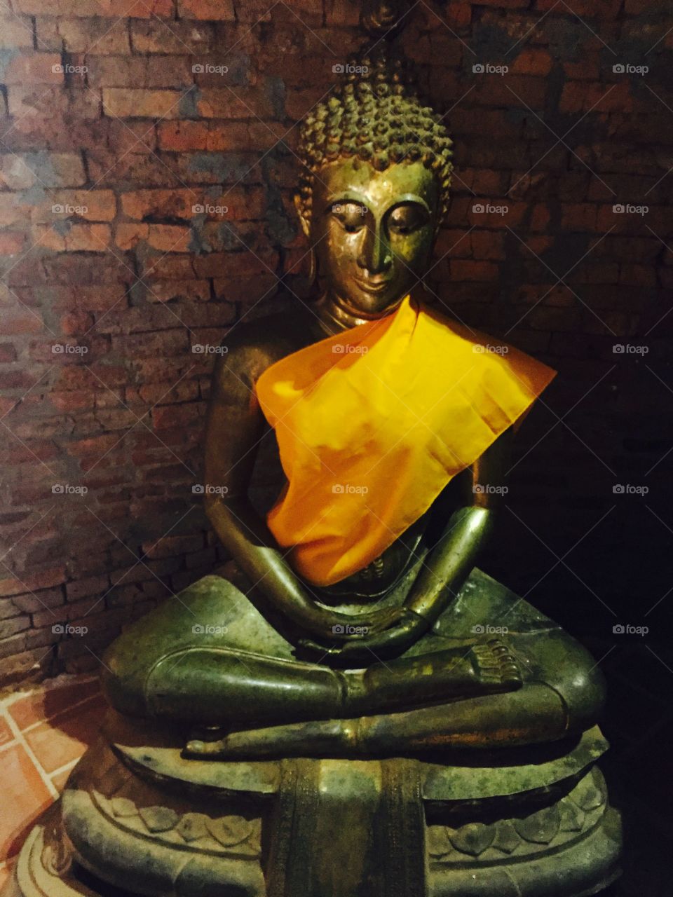 Clad in yellow Buddha