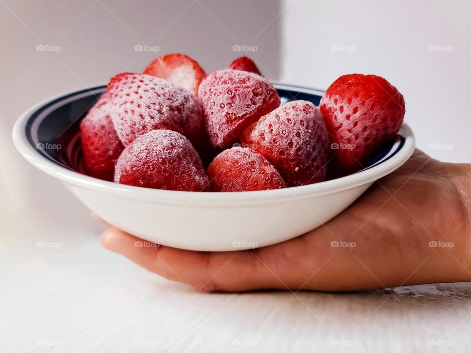 A bowl of frozen strawberries