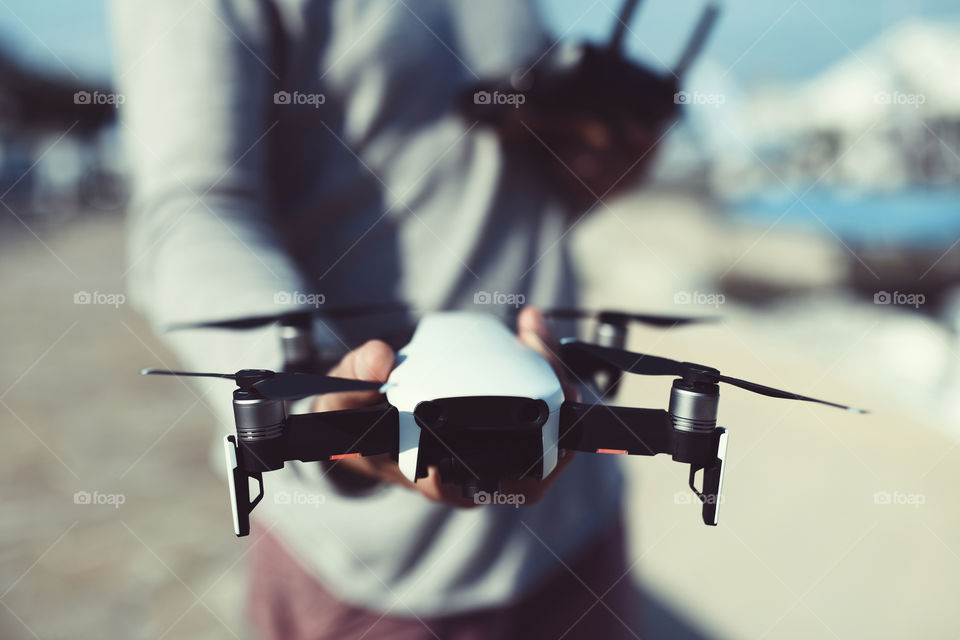 young man controls a drone