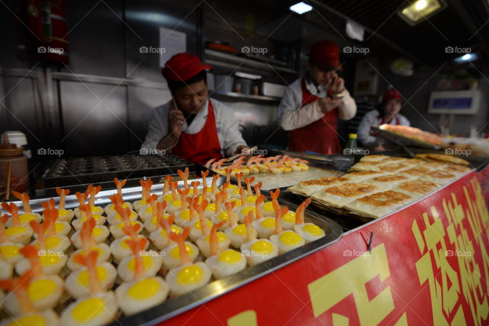 Asia, china streer food, candy with egg sellers shop