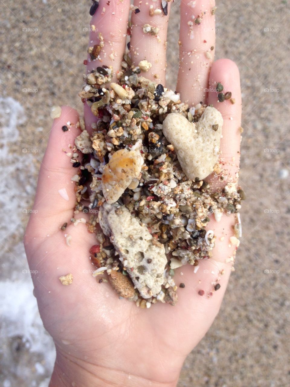 Beach Sand. Heart Rock