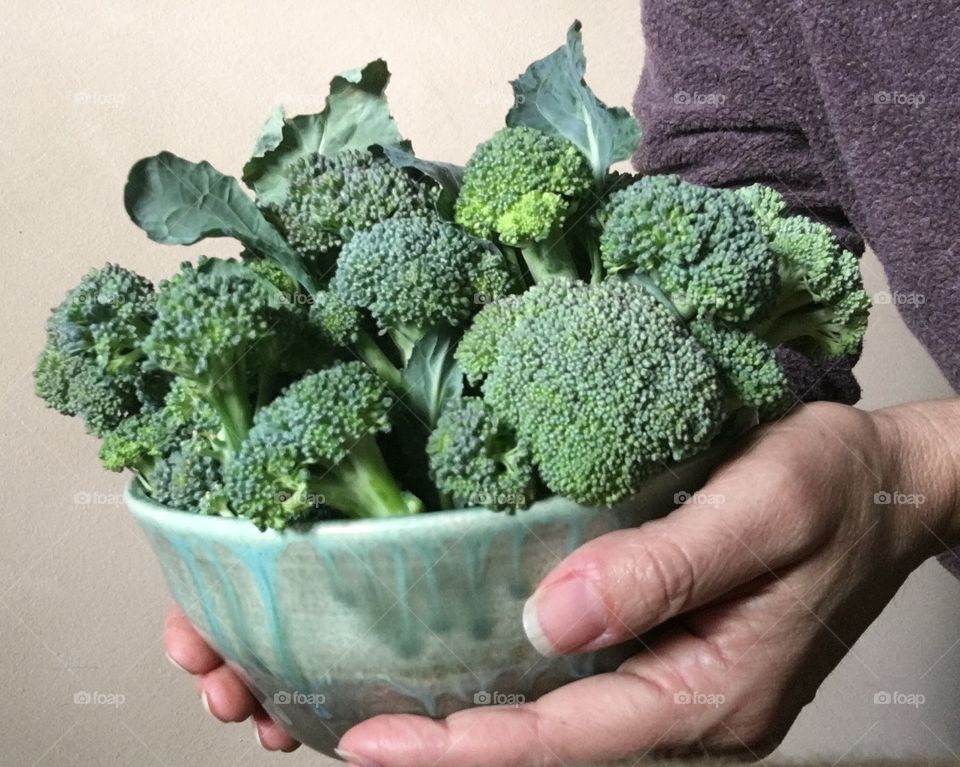 Holding broccoli 