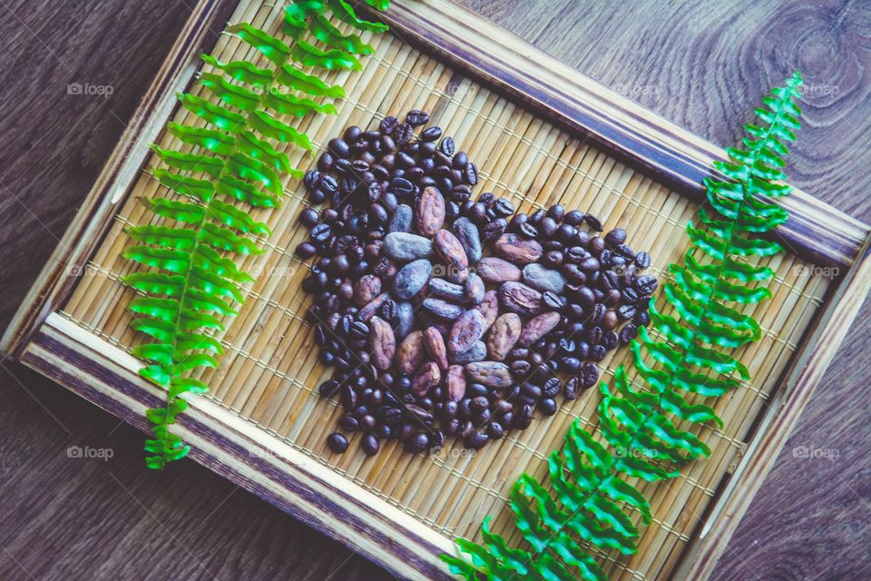 Heart shape made of coffee and cacoa beans
