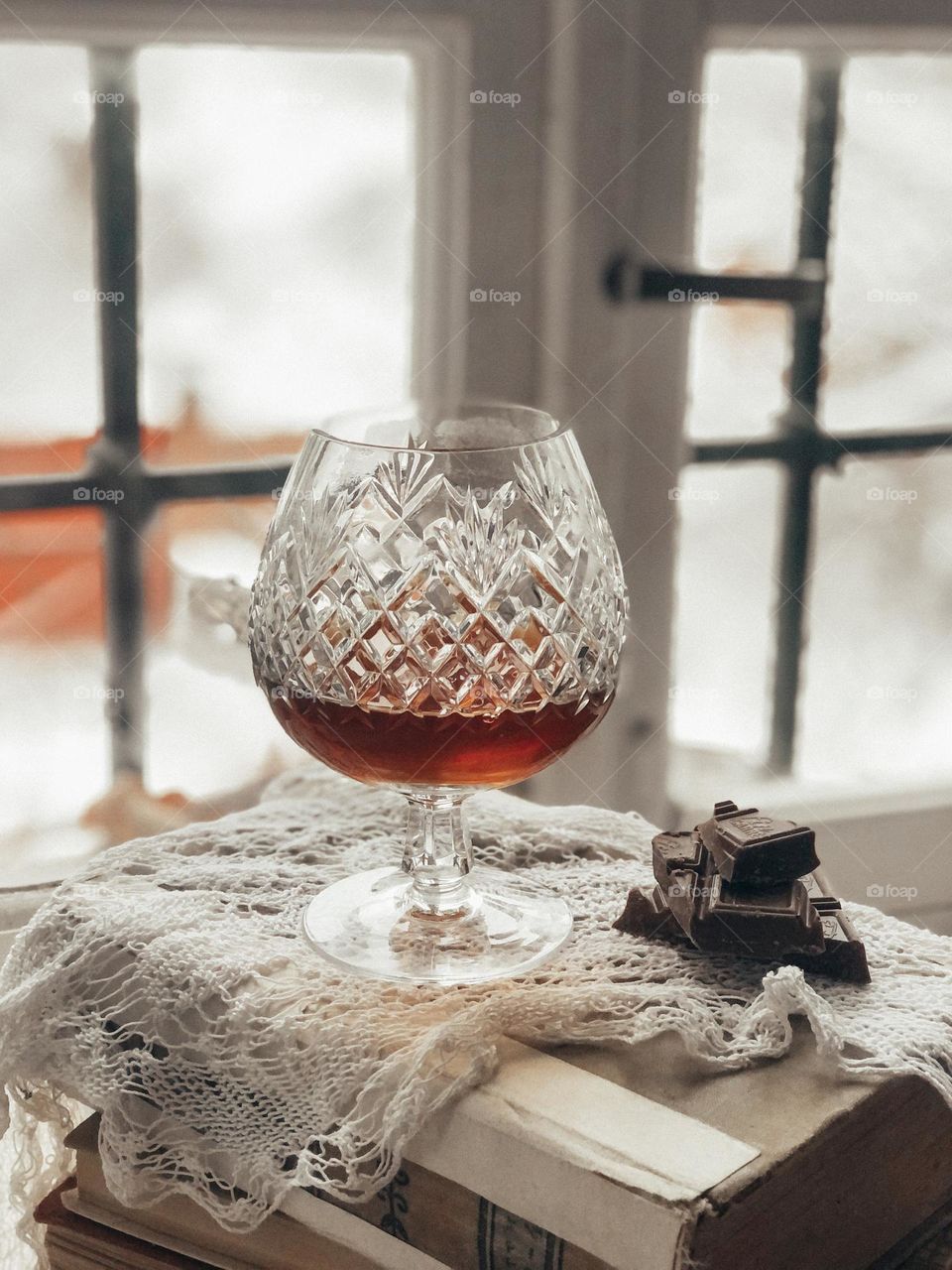 vintage crystal glass for cognac and chocolate still life