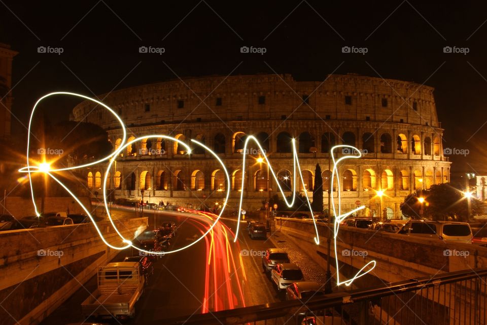 Long Exposure in front of the Roman Coliseum. Light drawing. 