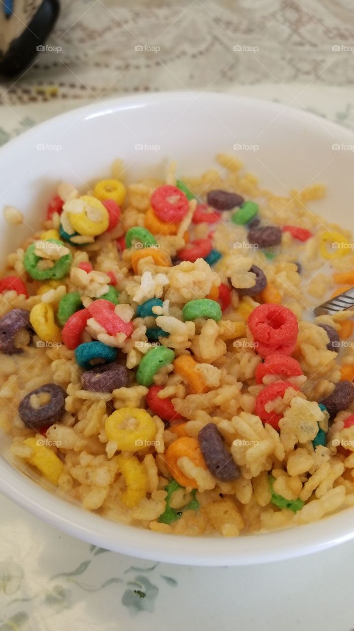 Happiness is colorful and important. Smile and enjoy a nice breakfast. Mixture of Rice Krispies and Fruit Loops with 2% fat milk....delicious.