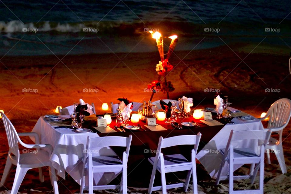 Ultimate summertime candlelight dinner on the beach for family and friends right after a surprise proposal. We even had our own personal waitress & tiki torches.  Such a beautiful experience and memories made that will never be forgotten.