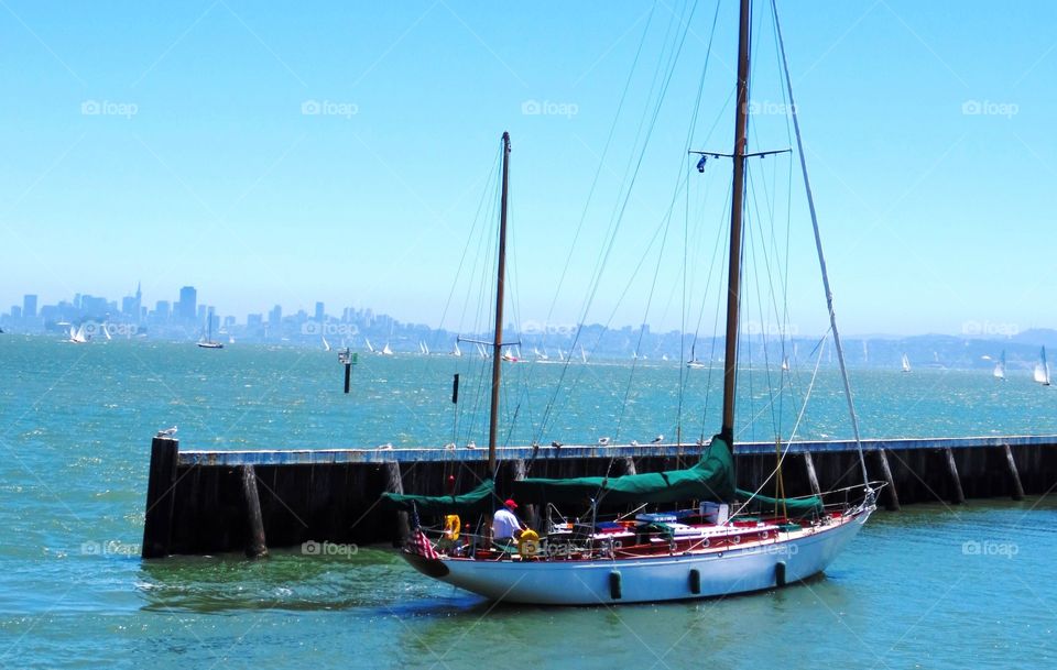 Let's go sailing. Beautiful bright day for sailing in the blue Pacific.. San Francisco skyline in the background