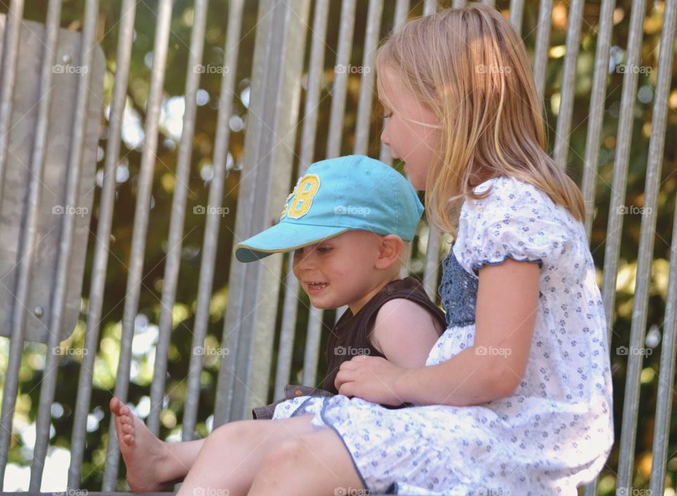 Brother and sister sitting and talking