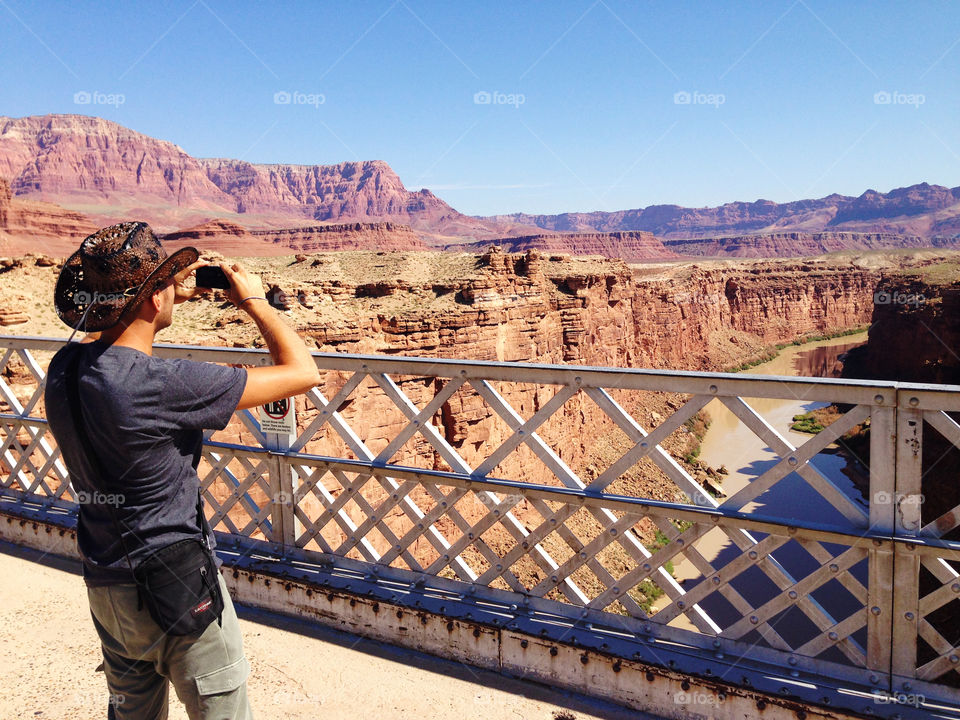 Cow boy on the marble canjon bridge,Arizona,United states