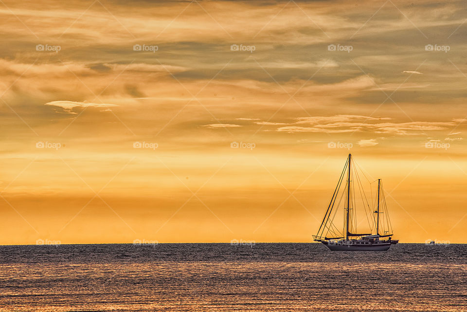 Sailboat sailing during sunset