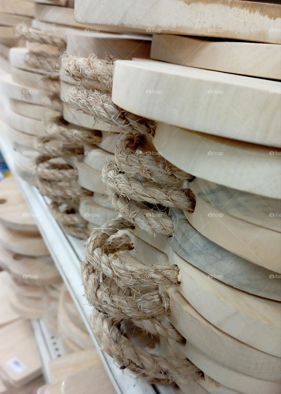 A group of cutting boards with rope