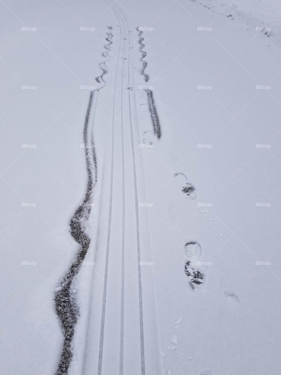 sled tracks with little mitten hand marks trailing on both sides, fun in the snow walking in a winter wonder land, toddlers
