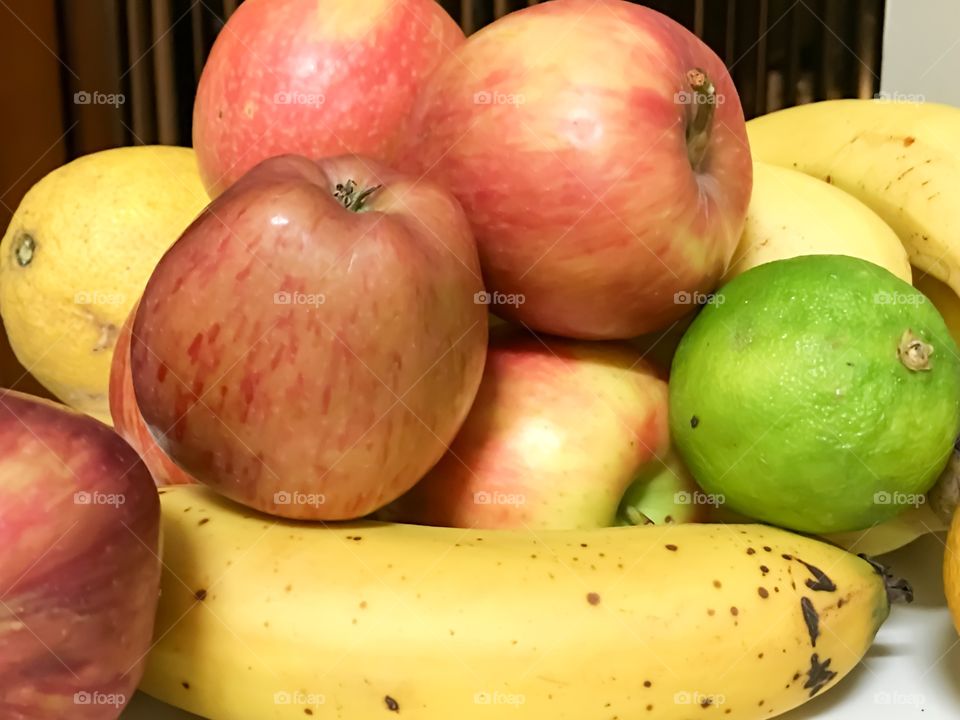 Fruit bowl apples bananas limes