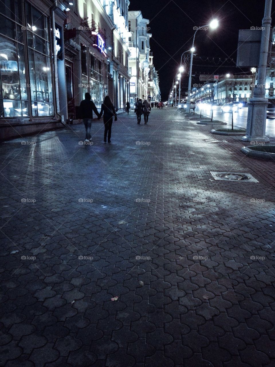 People walking by night