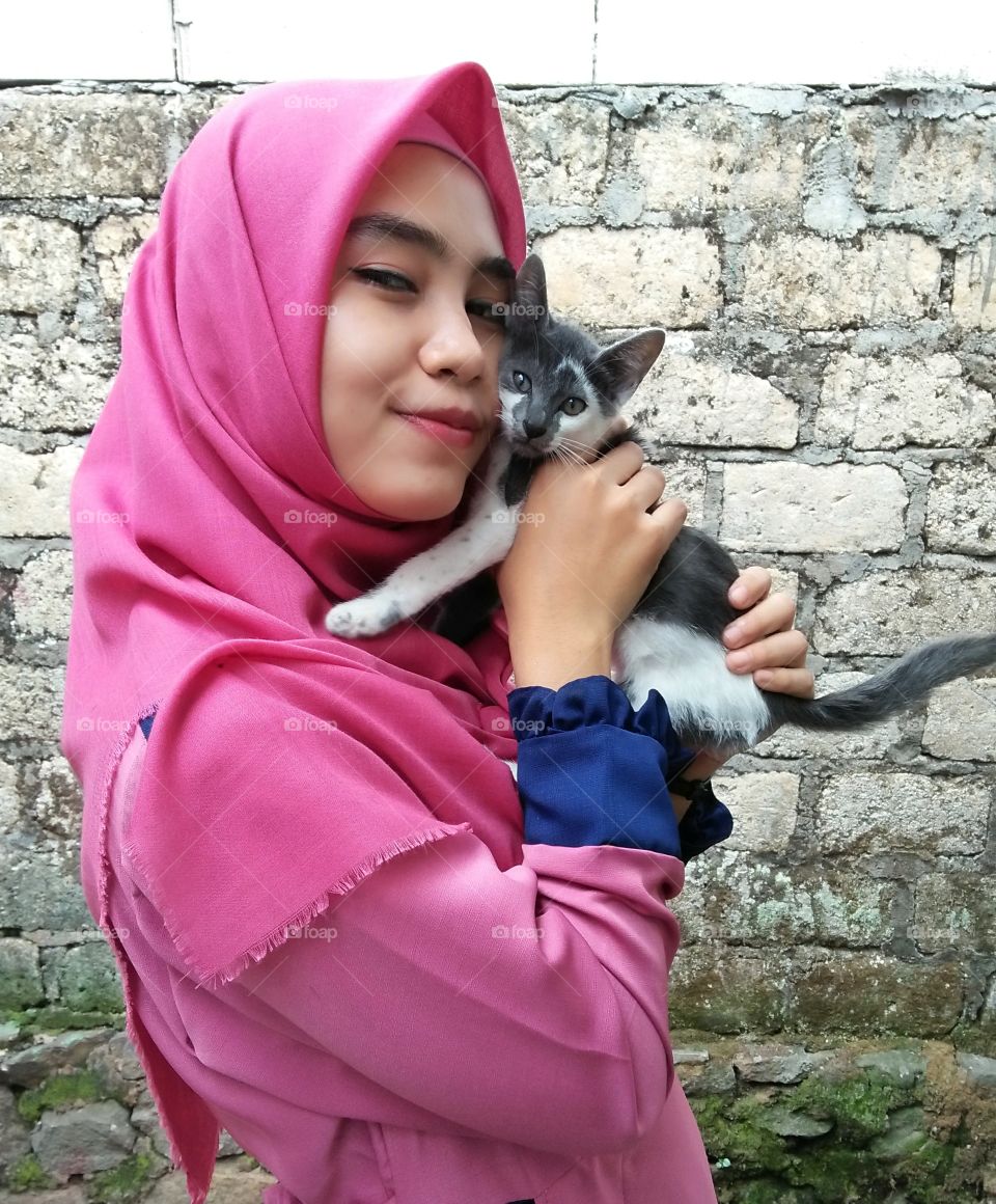Muslim girl and her kitten