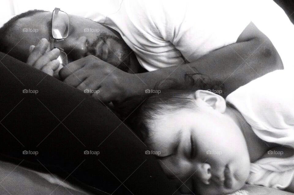 Baby and daddy sleeping