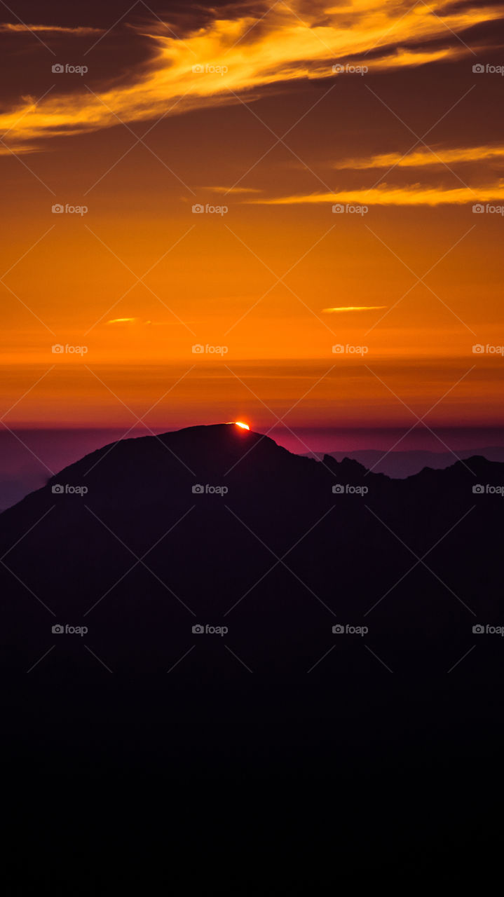 An inspiring purple mountain landscape. Tatry mountains in Slovakia. A beautiful wallpaper for smartphone screen. Purple abstract gradient with perspective.