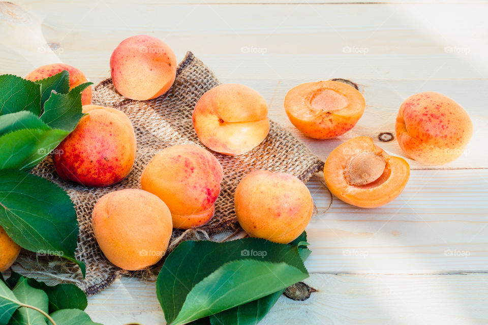 Fresh apricots picked straight from tree in the garden put on wooden table