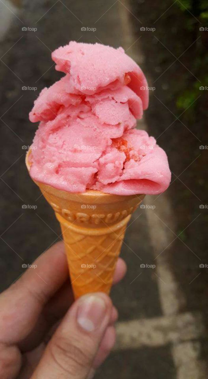 Person holding ice cream cone