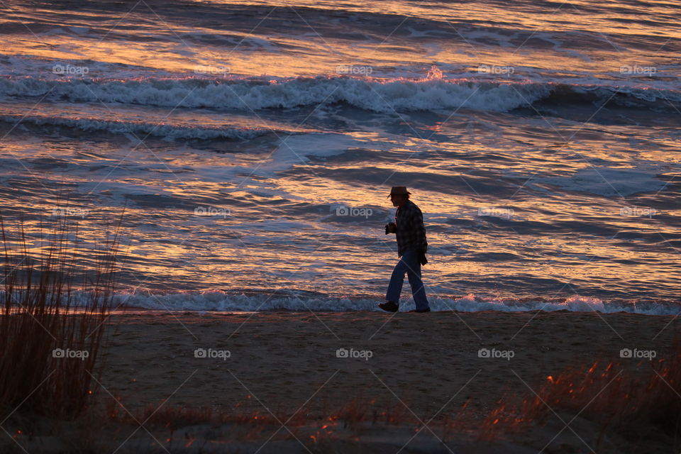 a walk on the beach at sunrise in winter