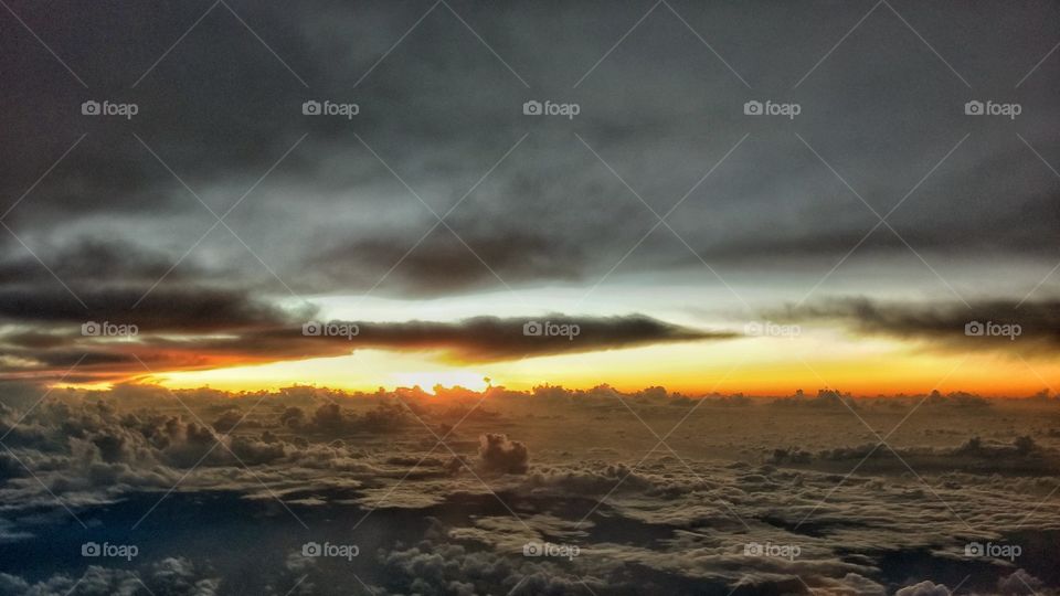 Sunset Over the Clouds