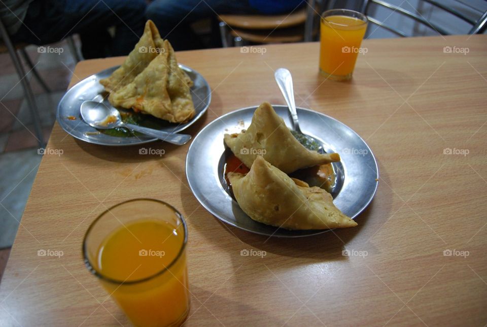 samosas with matar dal and juice