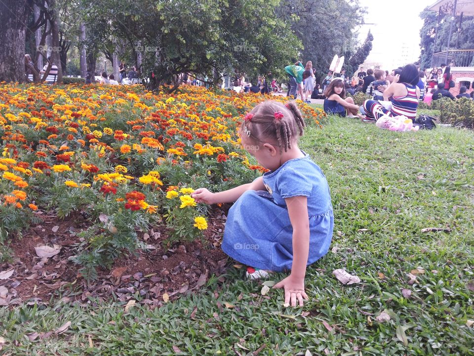 Little girl and flowers