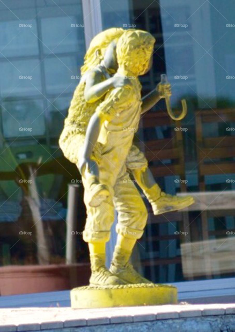 Yellow Statue by pool in Florida