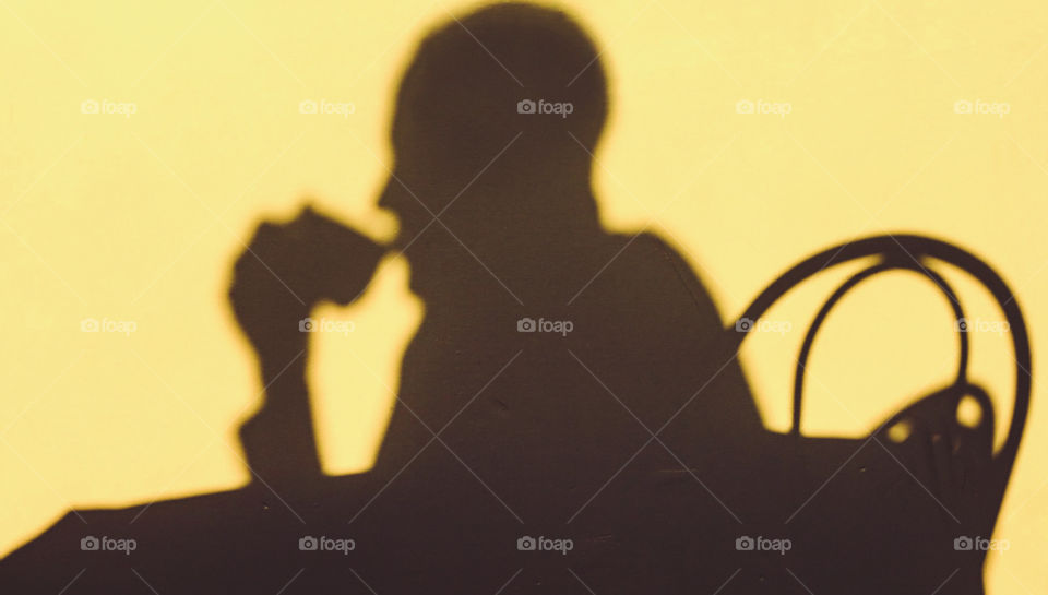 This image was taken shortly after a traditional celebration to welcome the Beltane sunrise on 1st May, here we see the silhouette of a person enjoying an early morning coffee in the warm glow of the newly risen sun