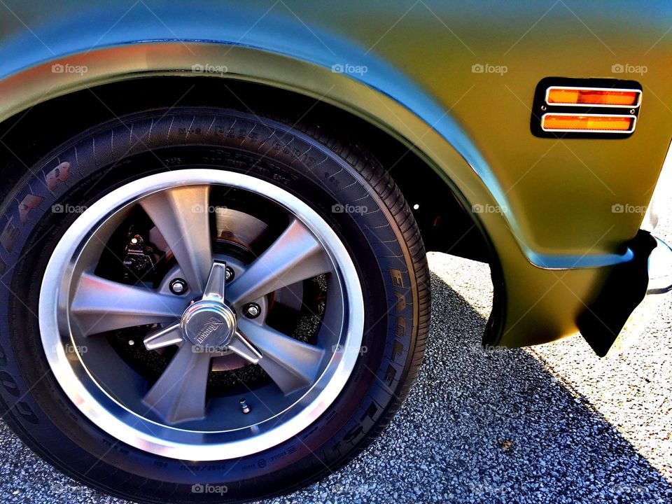 Classic car tires, image of tires and hubcap, low point of view image, Goodyear tires on a classic car 