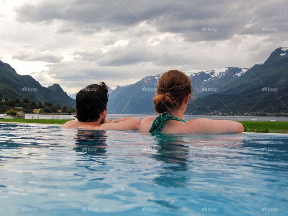 Couple in infinity pool 