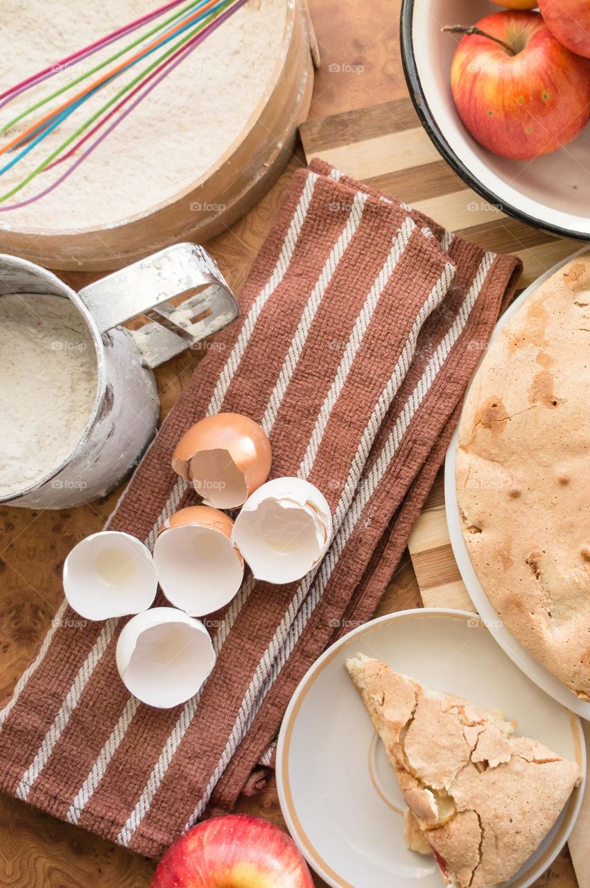 Making homemade puffed apple pie with eggs, sugar and flour.