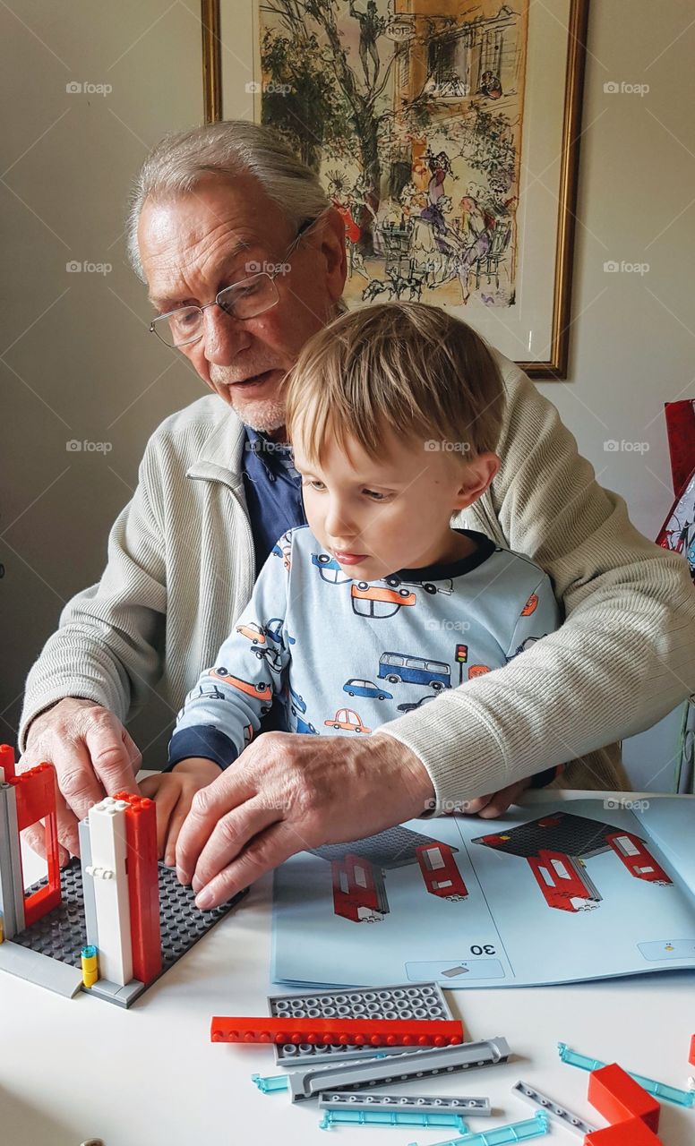 Building bricks with grandson