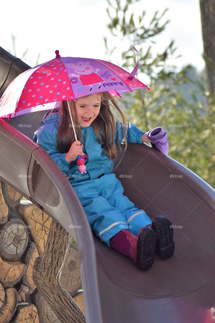 sliding with rain gear on