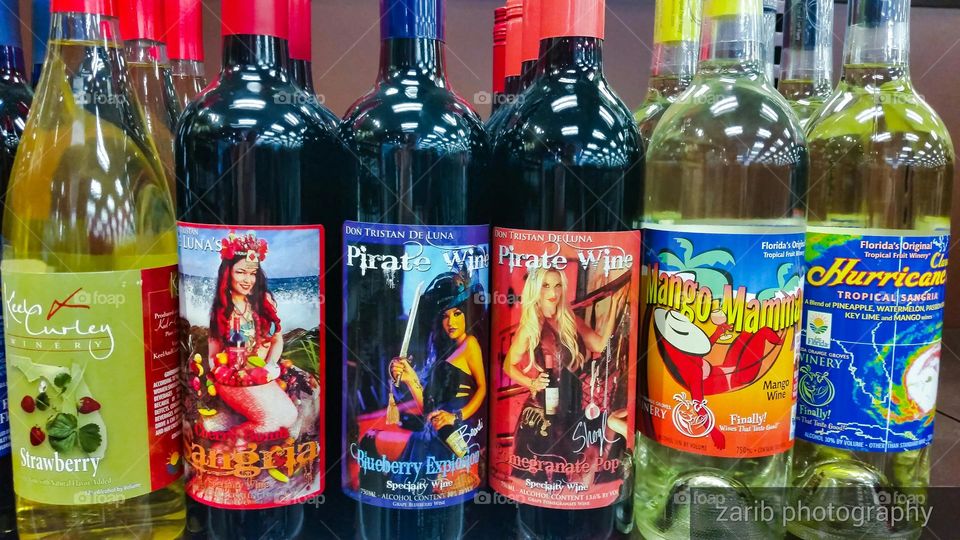 wine bottles with colorfull labels depicting women's in different  roles.