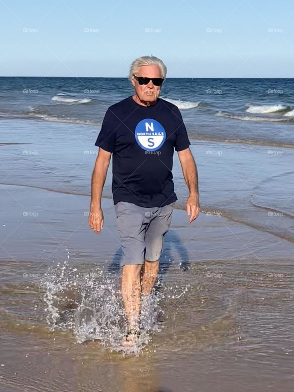 Father walking on beach 